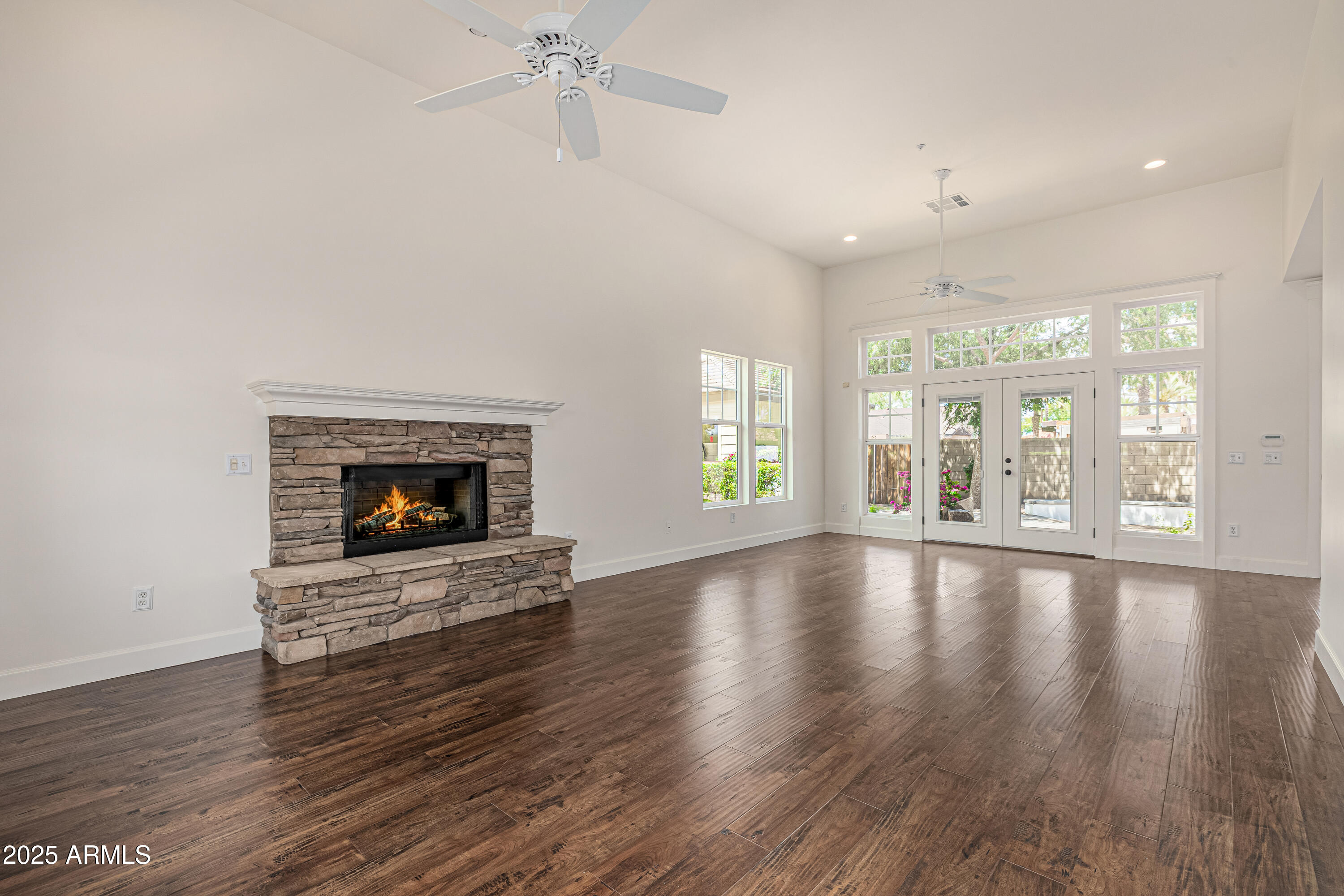 122 West Cottage Lane Tempe, AZ 85282 - Photo 8 of 43 a view of an empty room with wooden floor and a window