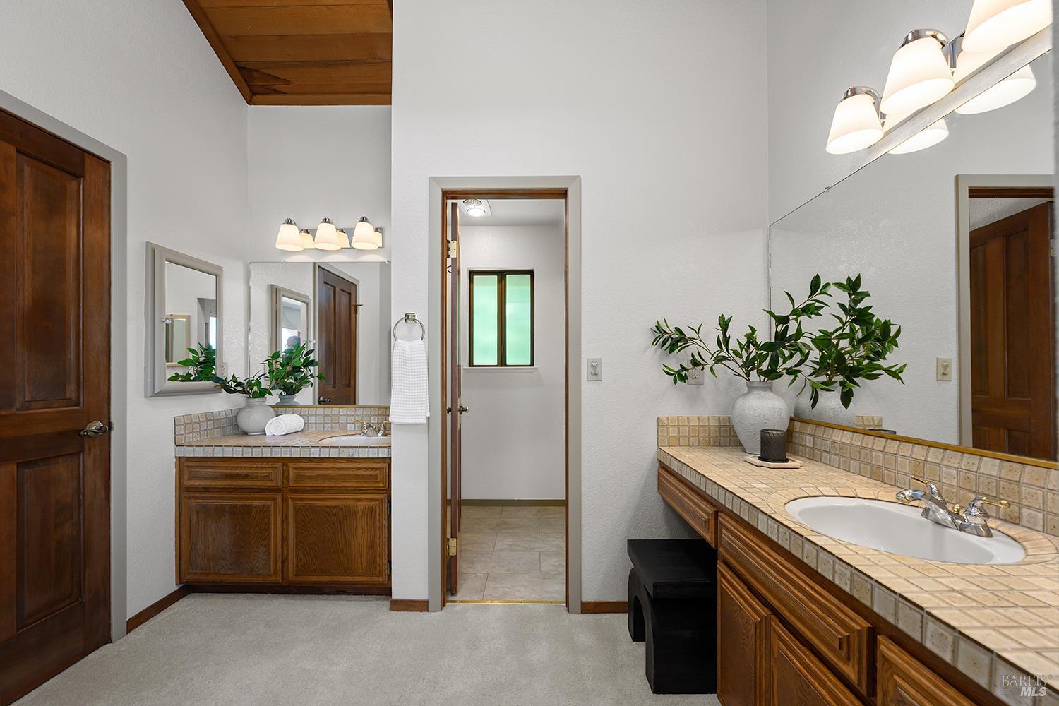 7595 Giusti Road Forestville, CA 95436 - Photo 27 of 41 a bathroom with a sink and a mirror