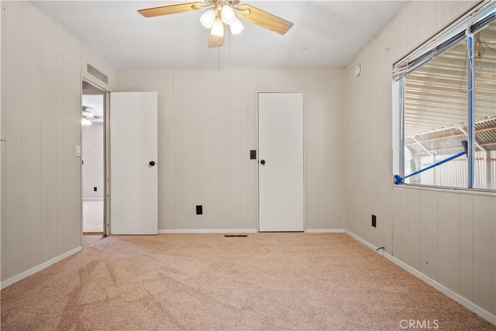 13393 Mariposa Road, Unit 169 Victorville, CA 92395 - Photo 19 of 36 a view of an empty room with a window