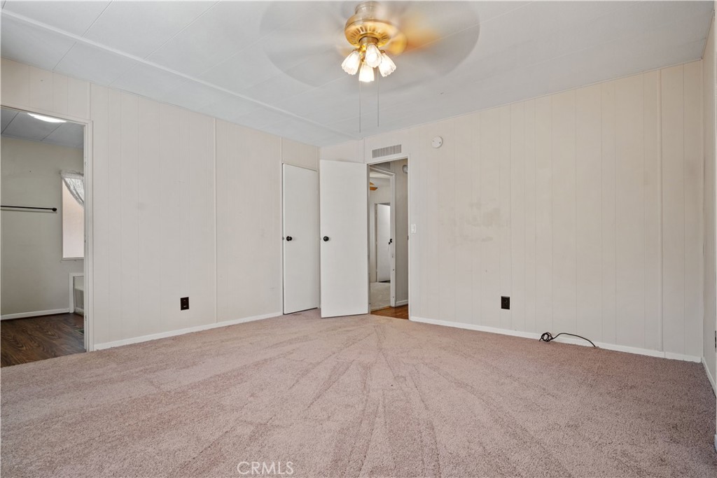 13393 Mariposa Road, Unit 169 Victorville, CA 92395 - Photo 23 of 36 a view of an empty room with a window