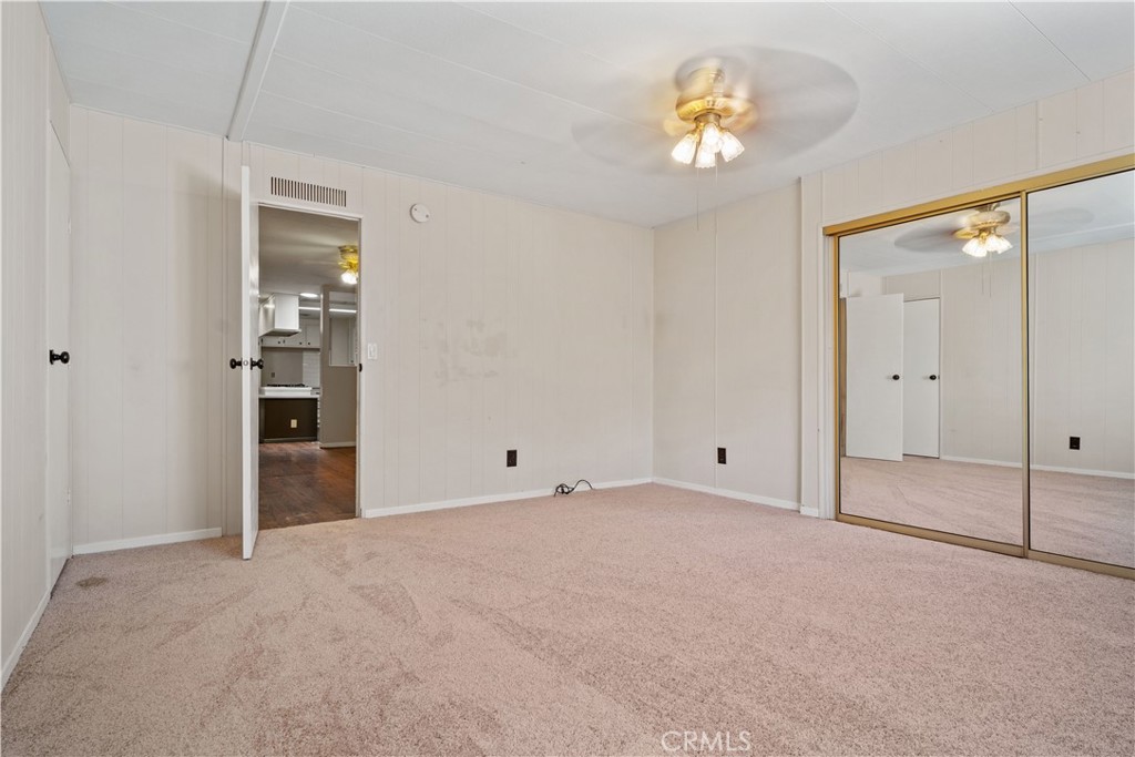 13393 Mariposa Road, Unit 169 Victorville, CA 92395 - Photo 24 of 36 a view of an empty room with a bathroom