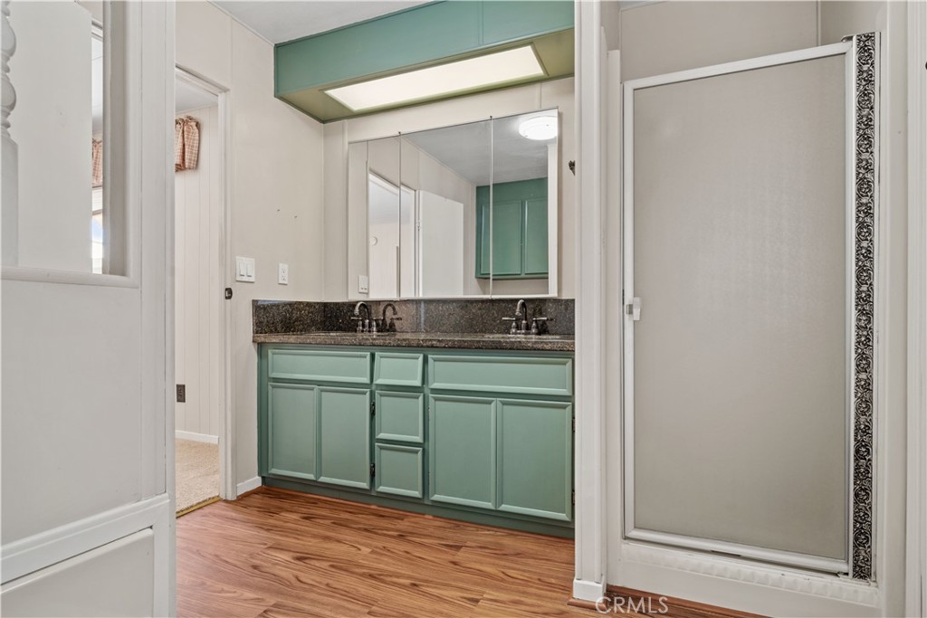 13393 Mariposa Road, Unit 169 Victorville, CA 92395 - Photo 27 of 36 a room with a sink and a mirror