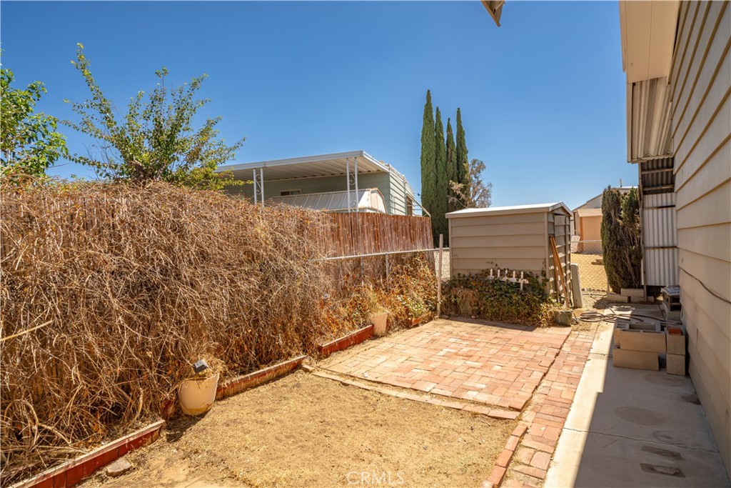 13393 Mariposa Road, Unit 169 Victorville, CA 92395 - Photo 32 of 36 a view of roof deck with two chairs and potted plants