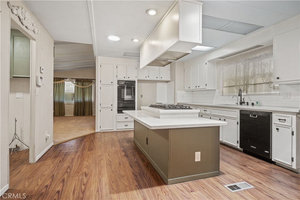 13393 Mariposa Road, Unit 169 Victorville, CA 92395 - Photo 6 of 36 a kitchen with a sink and cabinets
