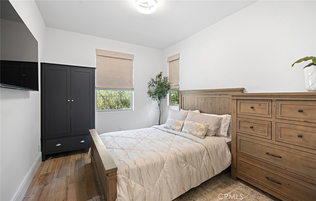 30 Windwalker Way Tustin, CA 92782 - Photo 11 of 22 a bedroom with a bed and a window