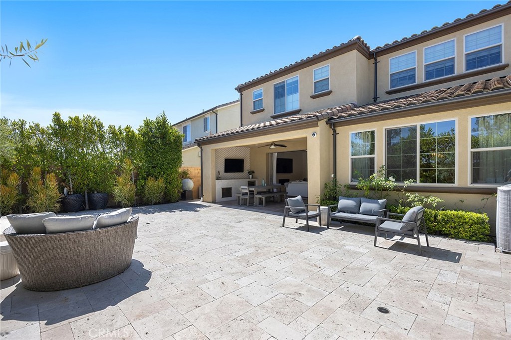 30 Windwalker Way Tustin, CA 92782 - Photo 21 of 22 a view of a patio with couches chairs and potted plants
