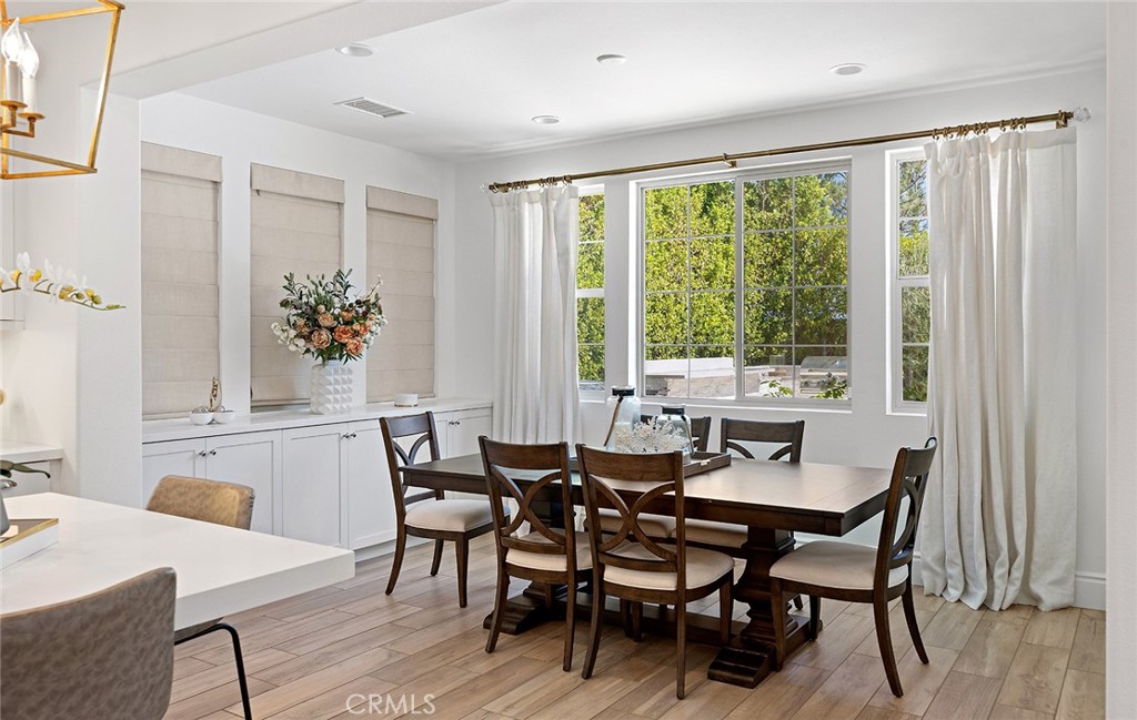 30 Windwalker Way Tustin, CA 92782 - Photo 5 of 22 a view of a dining room with furniture and wooden floor