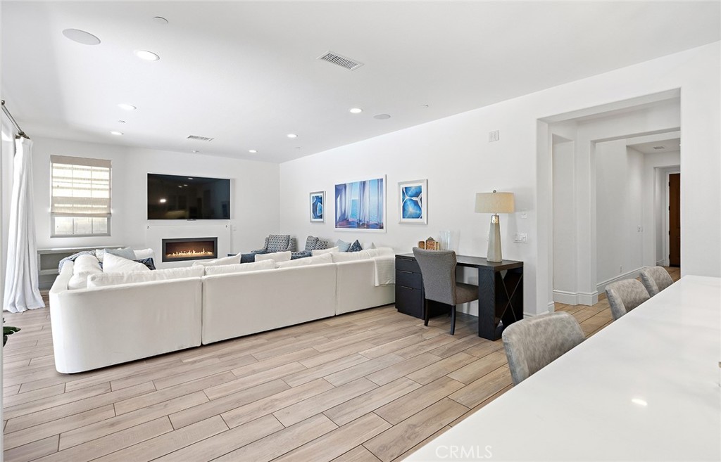 30 Windwalker Way Tustin, CA 92782 - Photo 6 of 22 a living room with furniture kitchen view and a flat screen tv