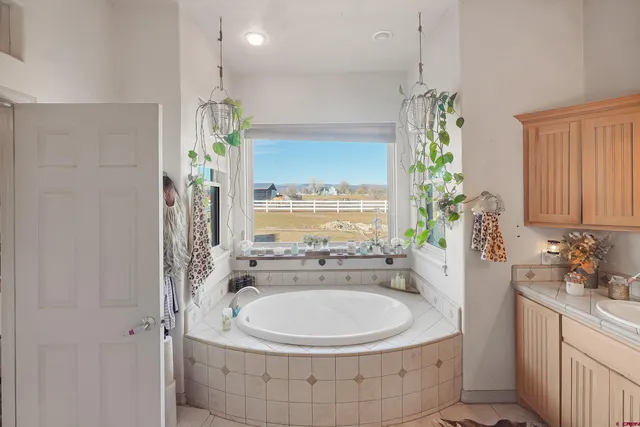 a view of walk in closet with clothes