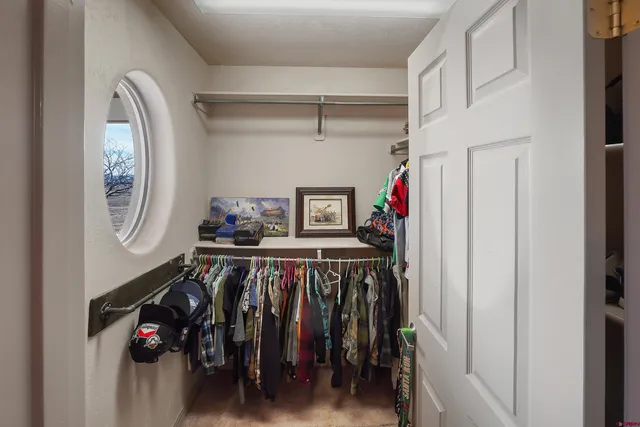 a bedroom with furniture and a chandelier
