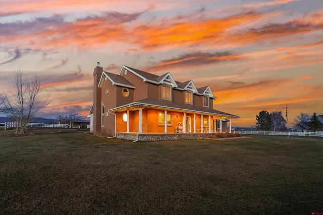 a view of a big house with a big yard