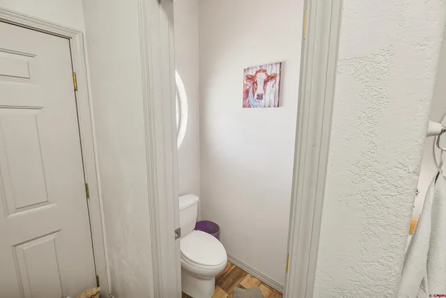 a view of a living room and a balcony