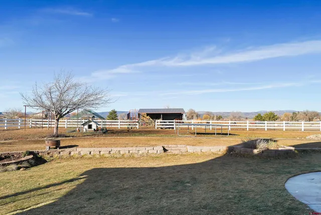 a view of a swimming pool and outdoor seating