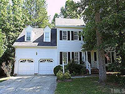 5112 Celbridge Place Raleigh, NC 27613 - Photo 1 of 1 a front view of a house with a garden
