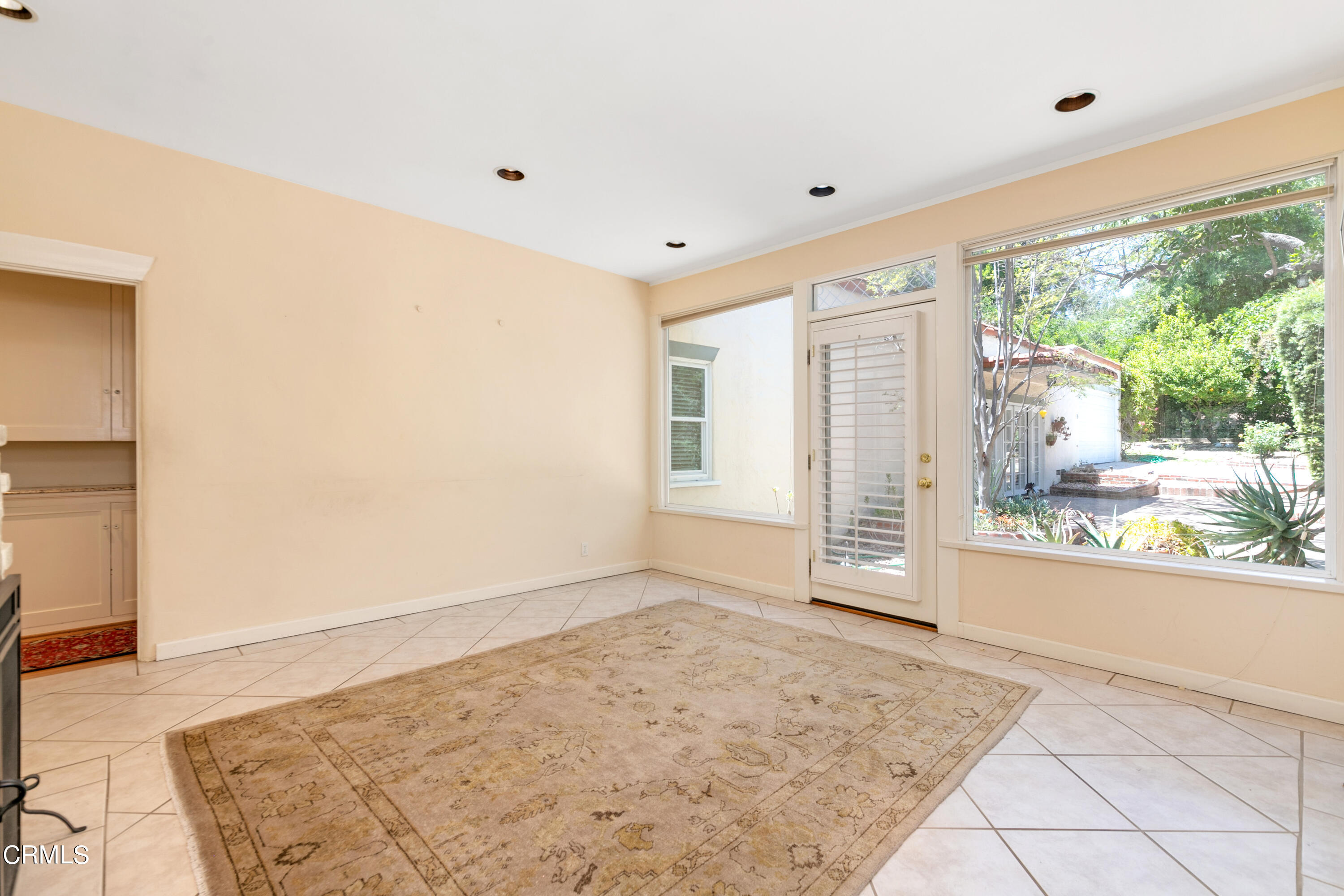 939 Old Mill Road Pasadena, CA 91108 - Photo 14 of 41 a view of a livingroom with wooden floor and a large window