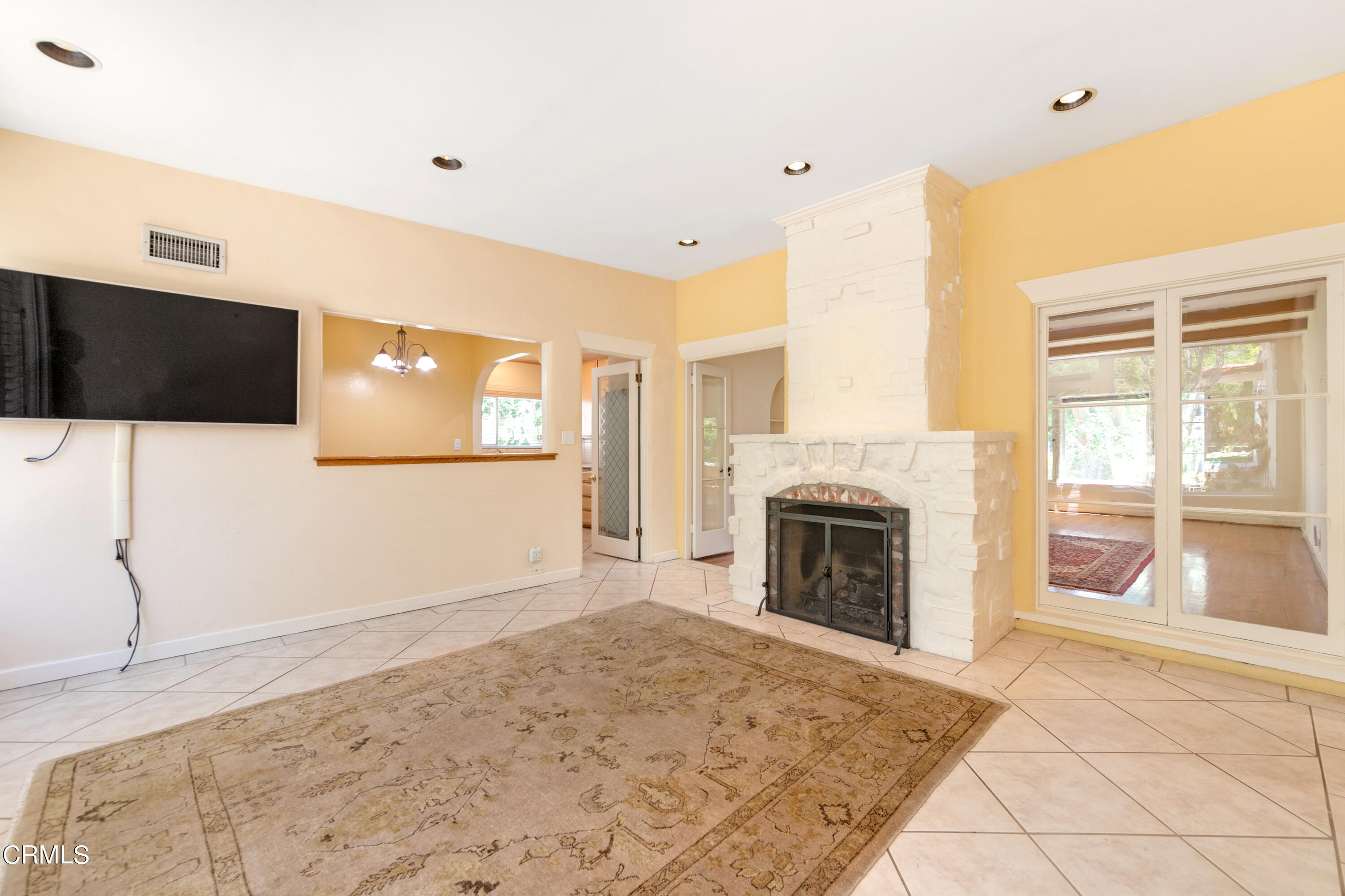 939 Old Mill Road Pasadena, CA 91108 - Photo 15 of 41 a view of a livingroom with a fireplace and window