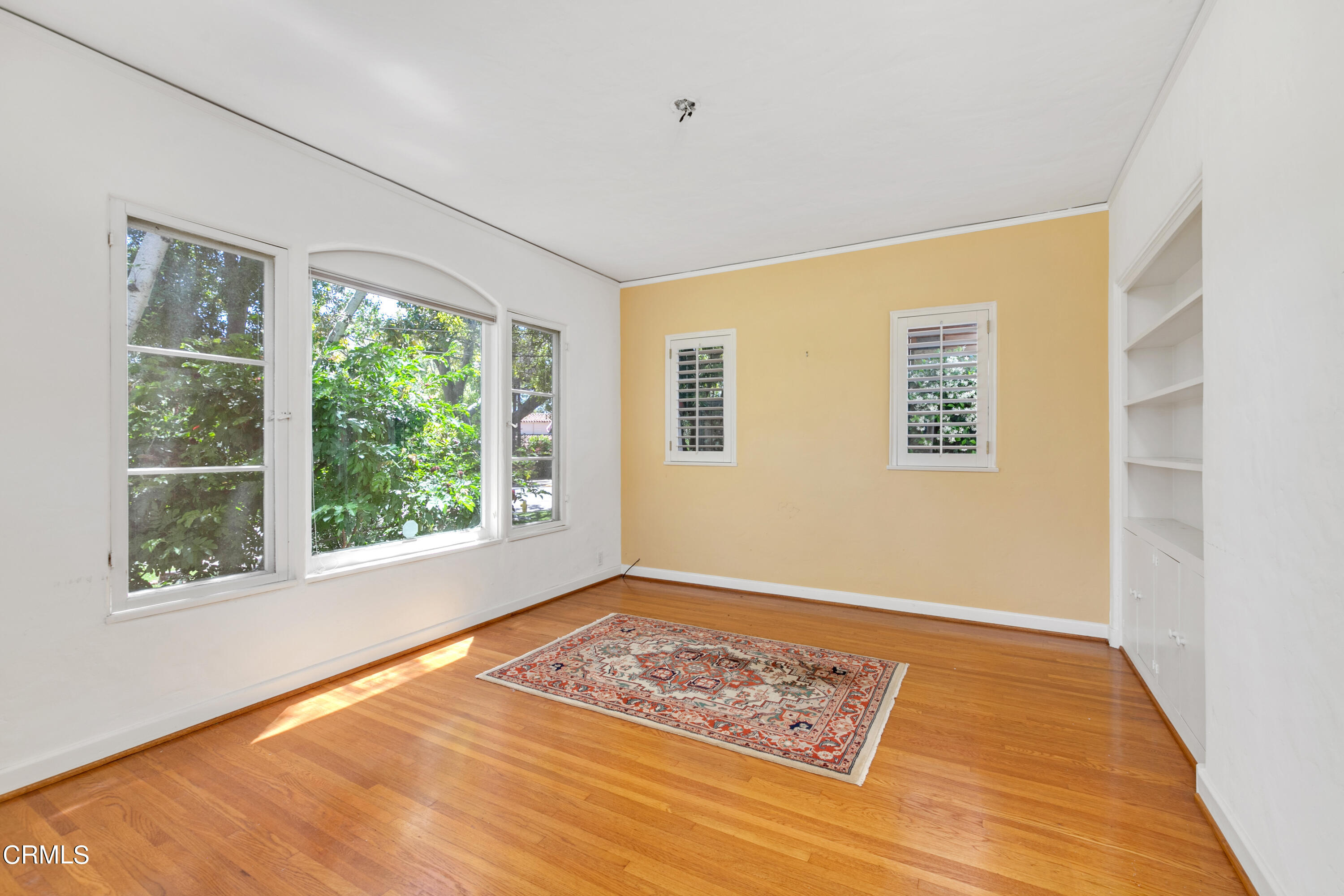 939 Old Mill Road Pasadena, CA 91108 - Photo 17 of 41 a view of an empty room with a window and hardwood floor