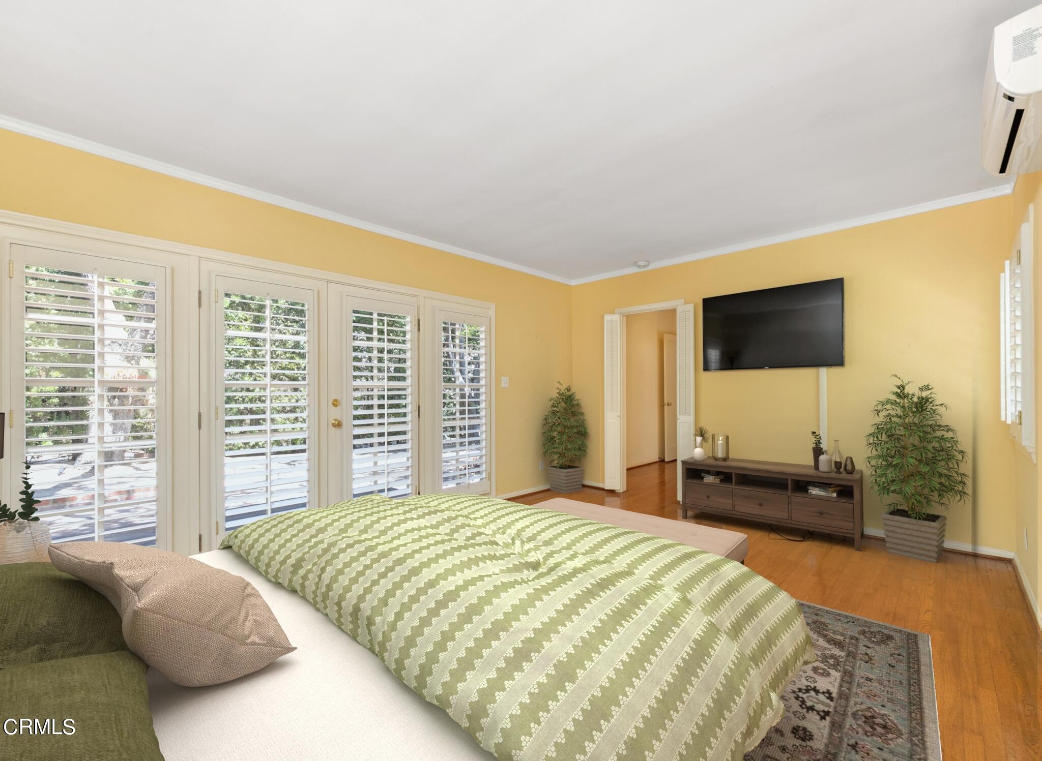 939 Old Mill Road Pasadena, CA 91108 - Photo 18 of 41 a bedroom with a bed and a flat screen tv