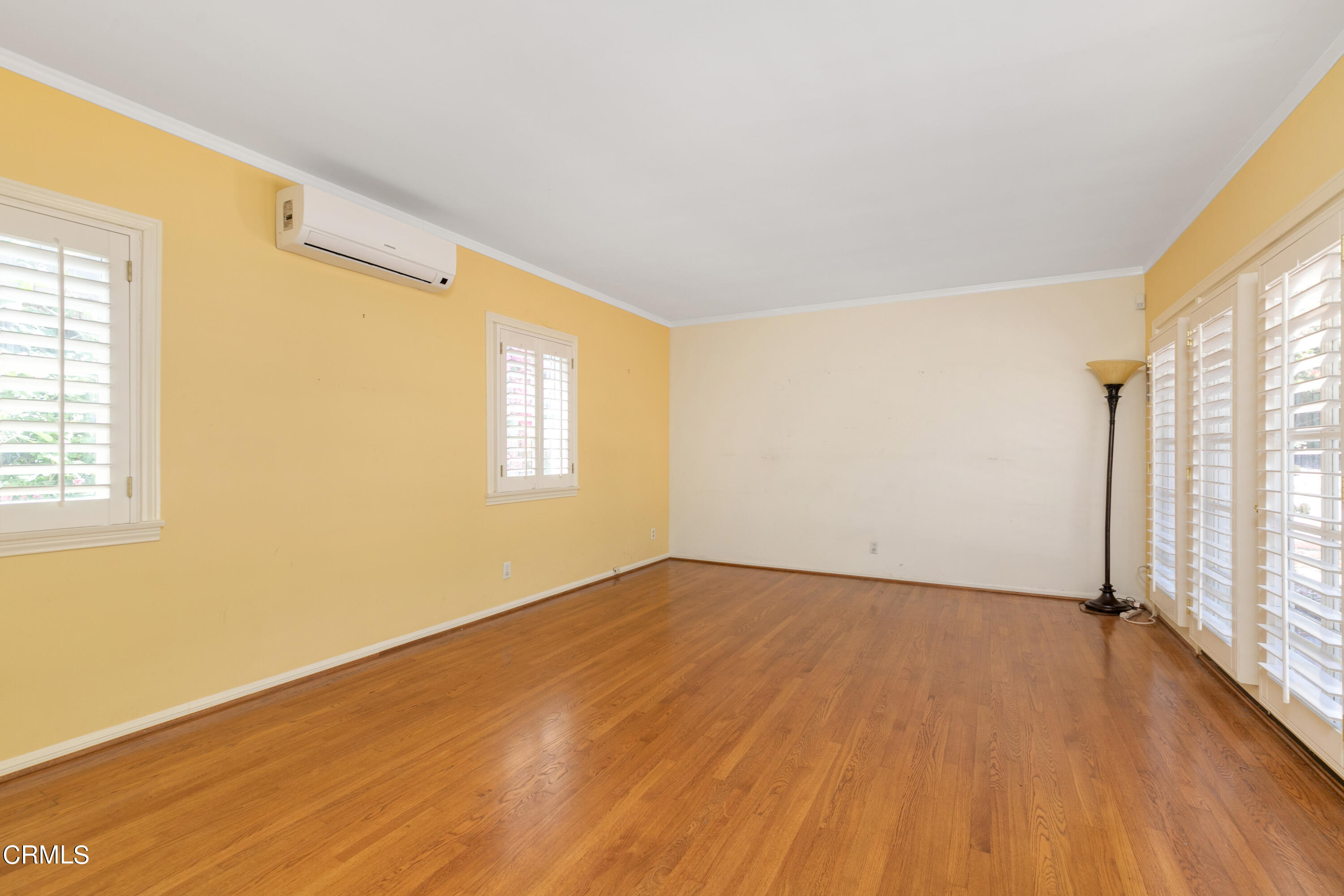 939 Old Mill Road Pasadena, CA 91108 - Photo 20 of 41 an empty room with wooden floor and windows