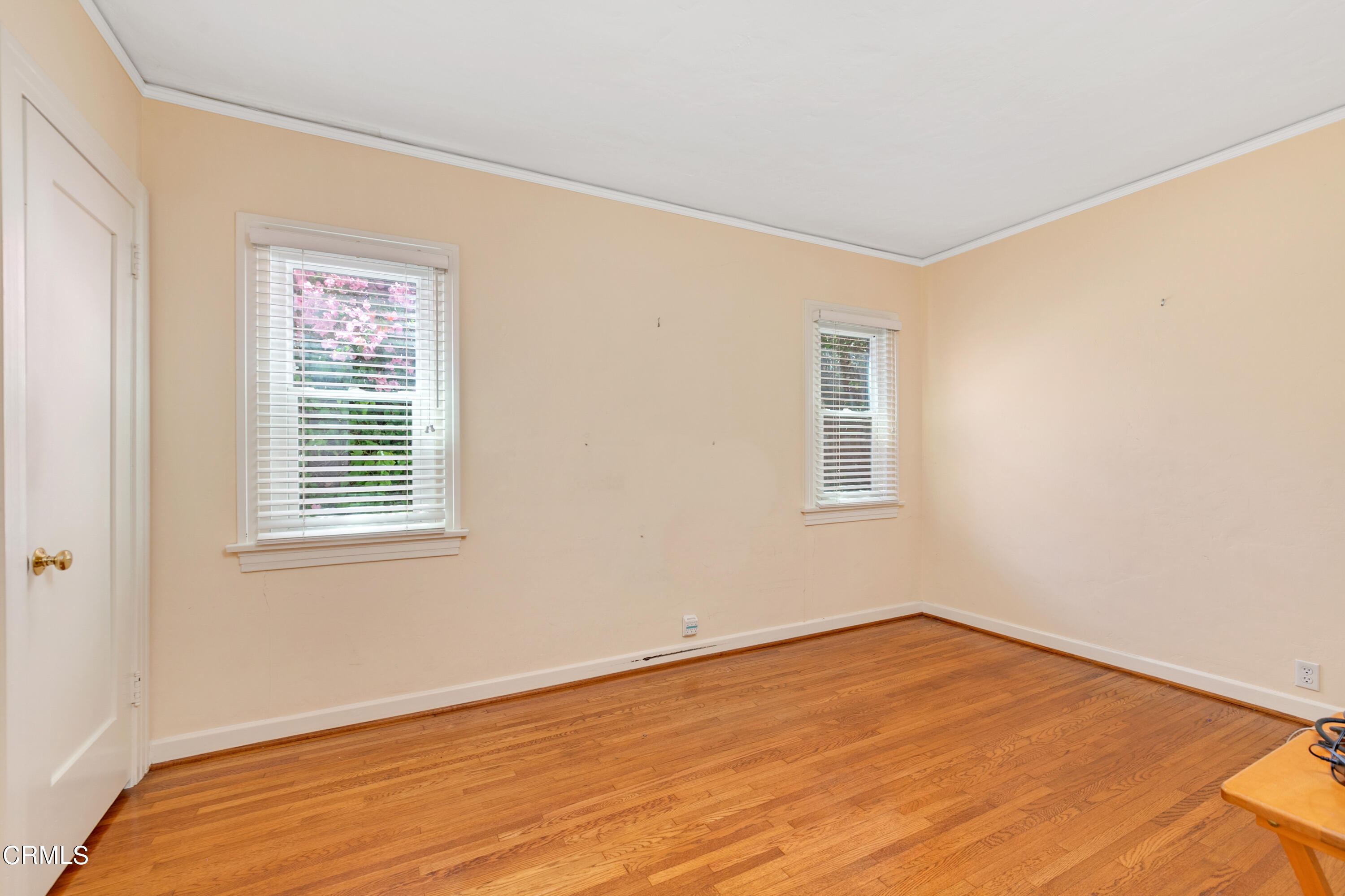 939 Old Mill Road Pasadena, CA 91108 - Photo 26 of 41 a view of an empty room with wooden floor and a window