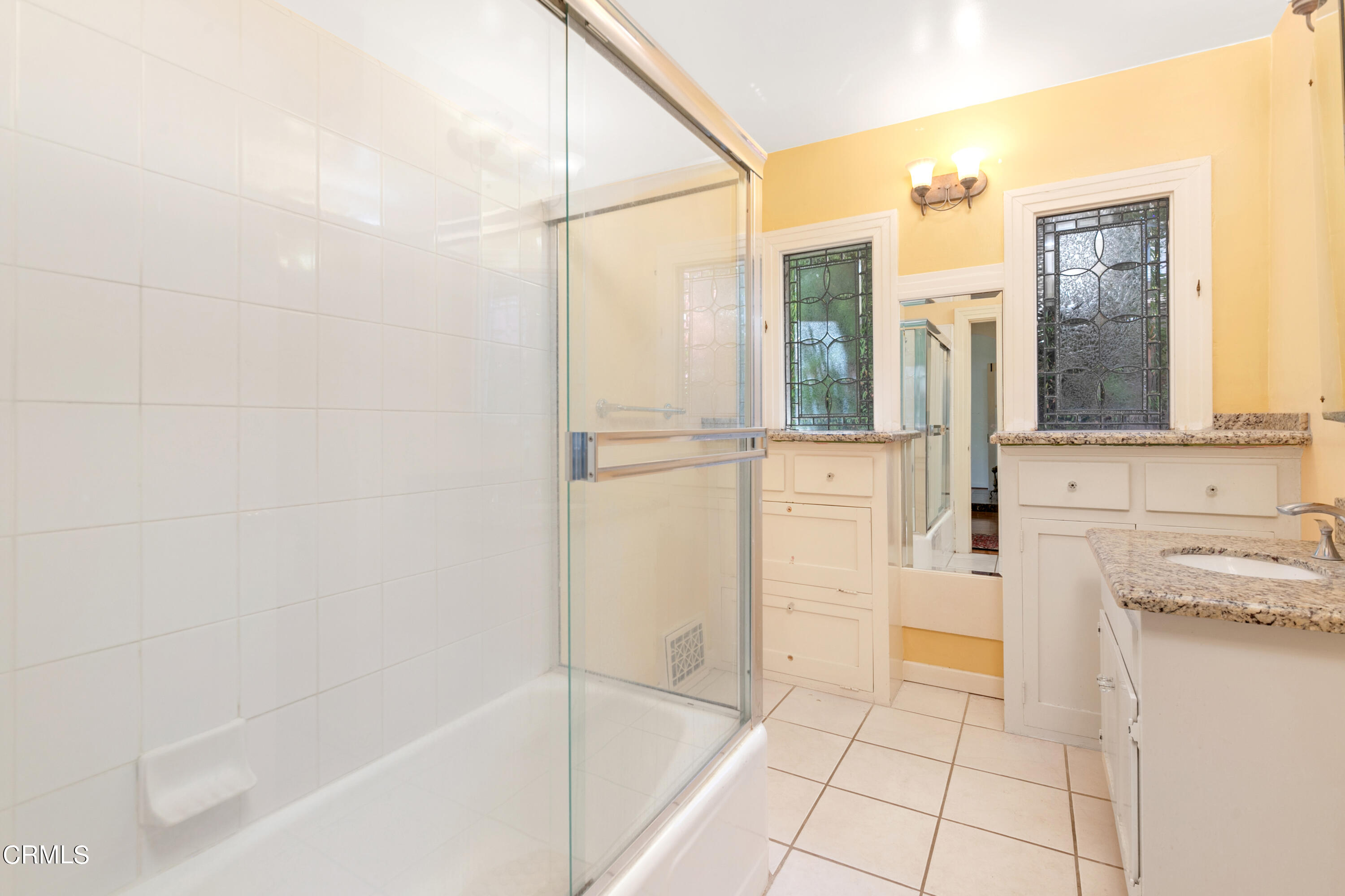 939 Old Mill Road Pasadena, CA 91108 - Photo 31 of 41 a bathroom with a tub shower and sink