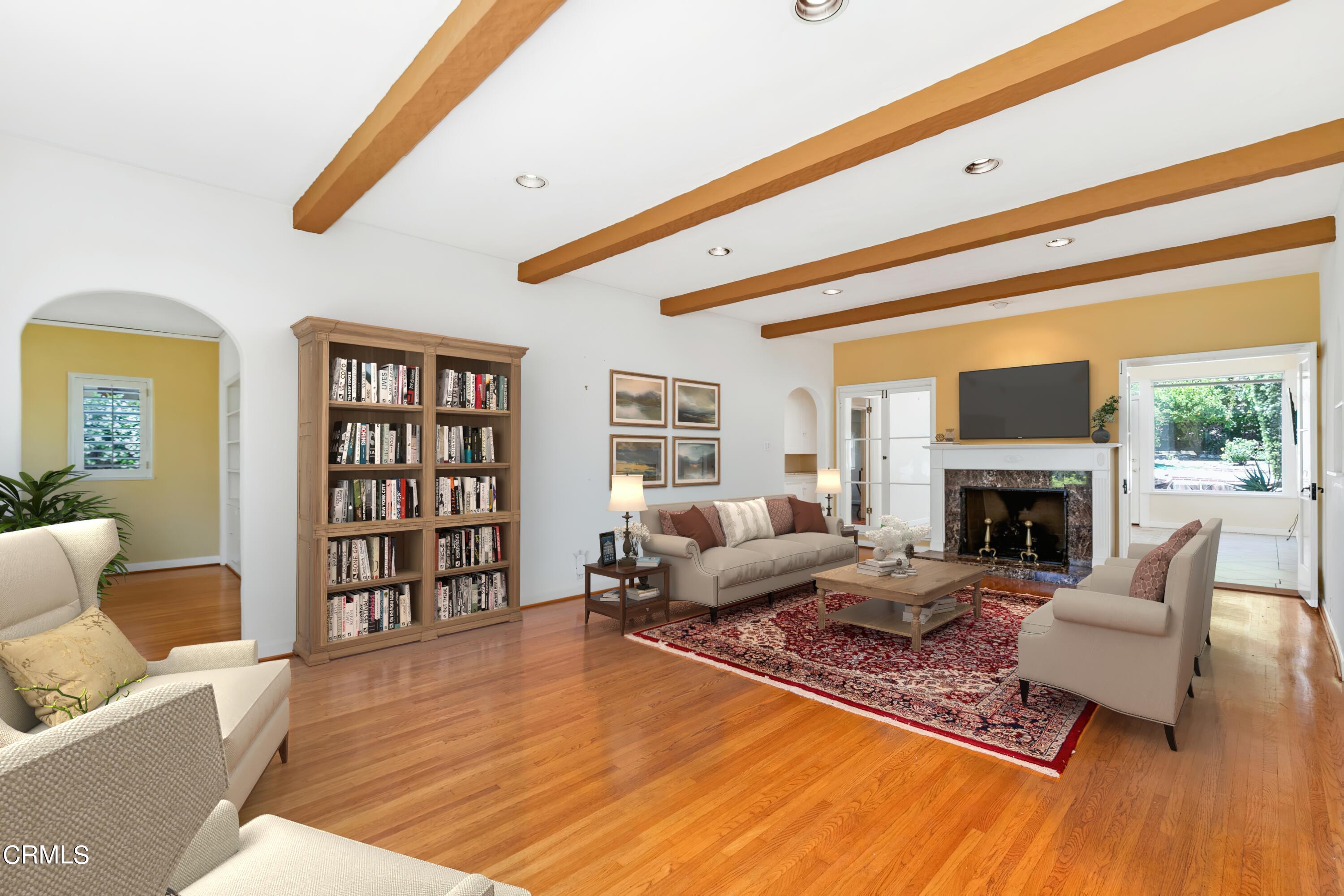 939 Old Mill Road Pasadena, CA 91108 - Photo 7 of 41 a living room with furniture hard wood floor and a fireplace