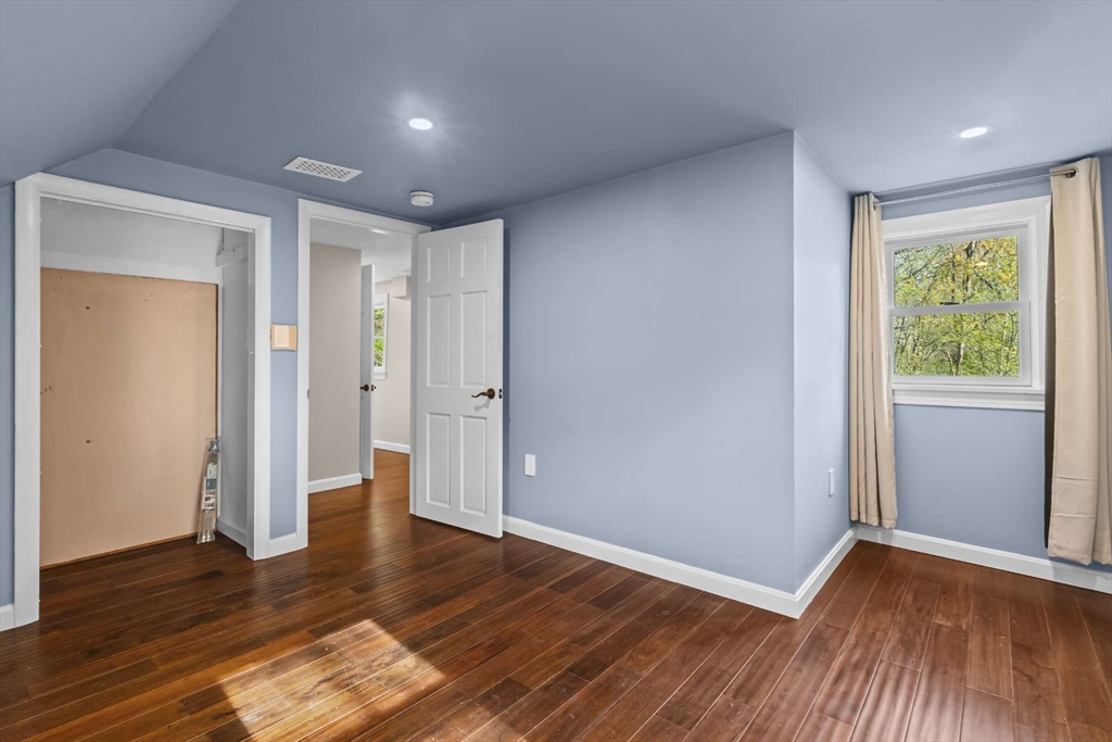 7 Darrow Street Worcester, MA 01606 - Photo 32 of 42 an empty room with wooden floor and windows