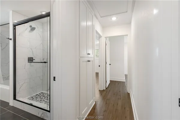 a view of a bathroom from a hallway