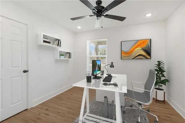 a view of a workspace with furniture