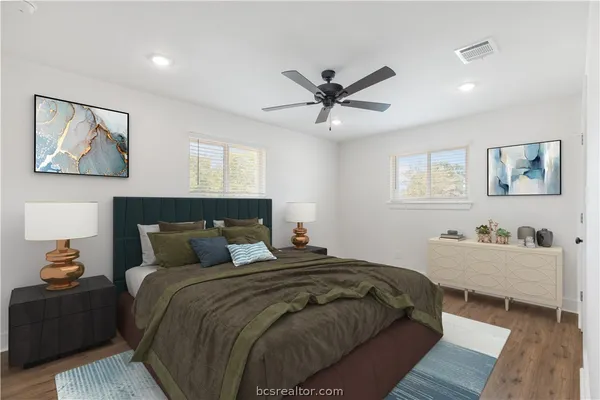 a bedroom with a bed and window