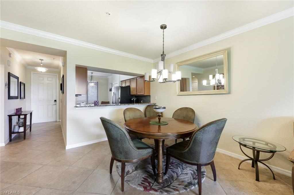 Undisclosed Address Naples, FL 34113 - Photo 11 of 24 a view of a dining room with furniture and chandelier