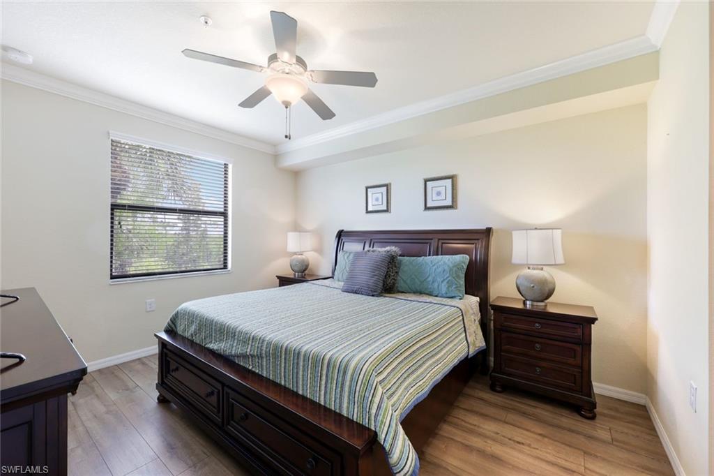 Undisclosed Address Naples, FL 34113 - Photo 12 of 24 a bedroom with a bed and a ceiling fan