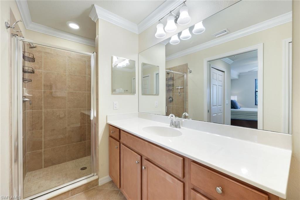 Undisclosed Address Naples, FL 34113 - Photo 14 of 24 a bathroom with a sink shower and a mirror