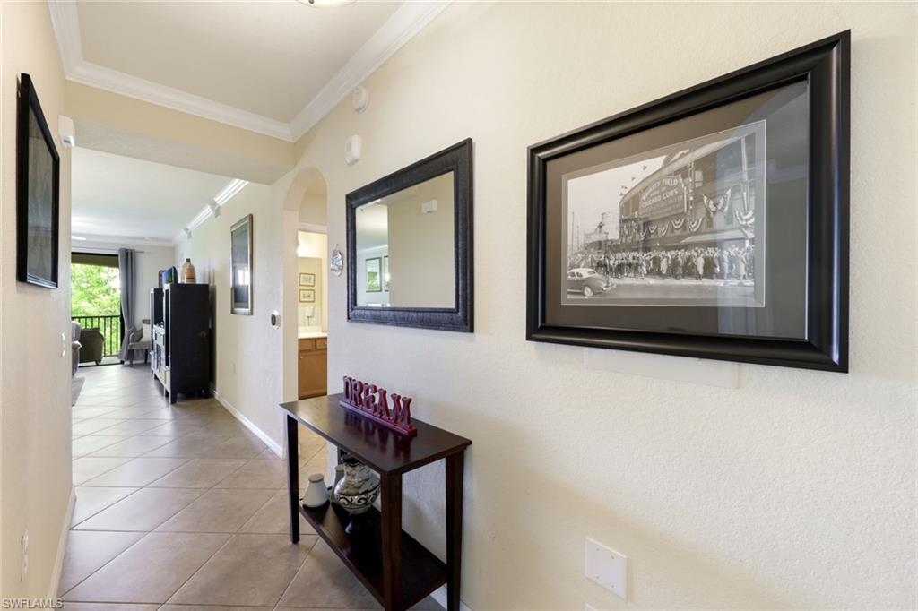 Undisclosed Address Naples, FL 34113 - Photo 2 of 24 a view of a hallway with furniture and a window