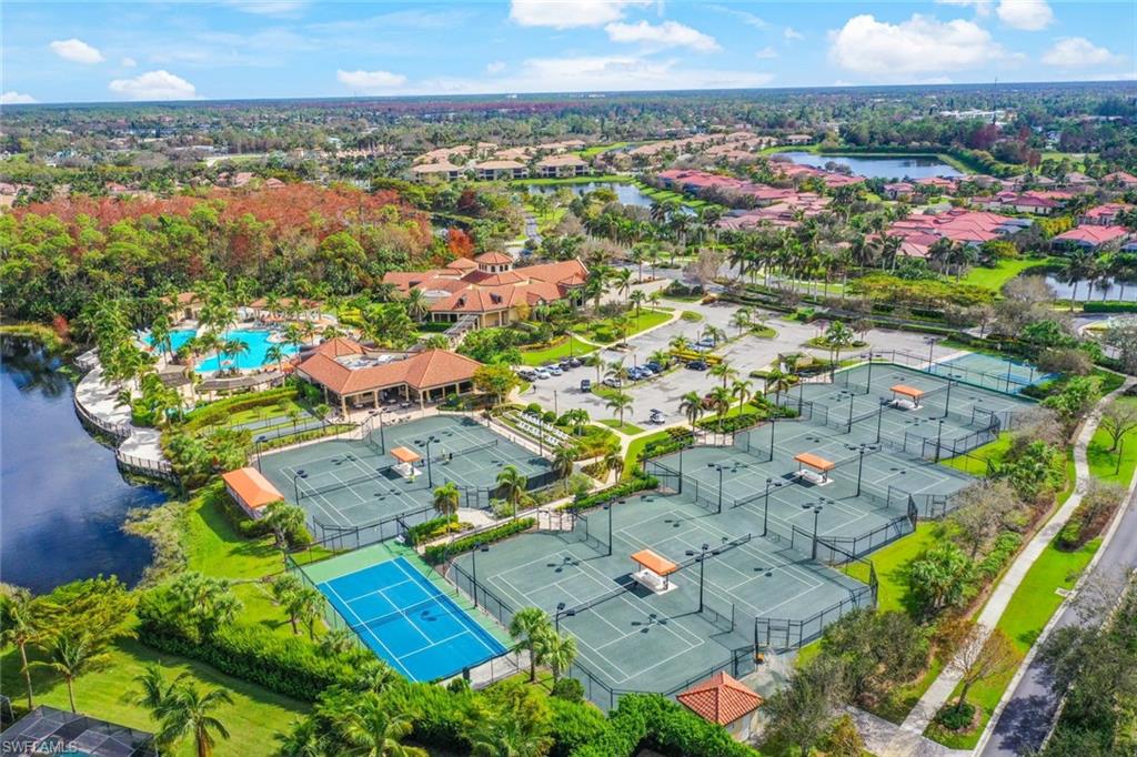 Undisclosed Address Naples, FL 34113 - Photo 20 of 24 an aerial view of residential houses with outdoor space and trees