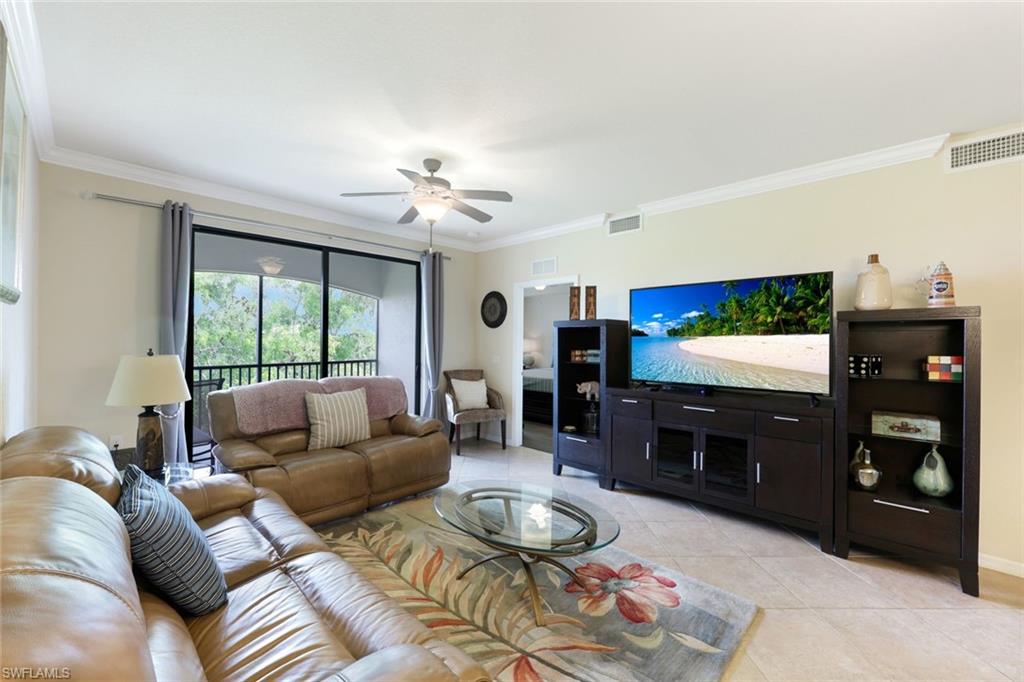Undisclosed Address Naples, FL 34113 - Photo 3 of 24 a living room with furniture and a flat screen tv