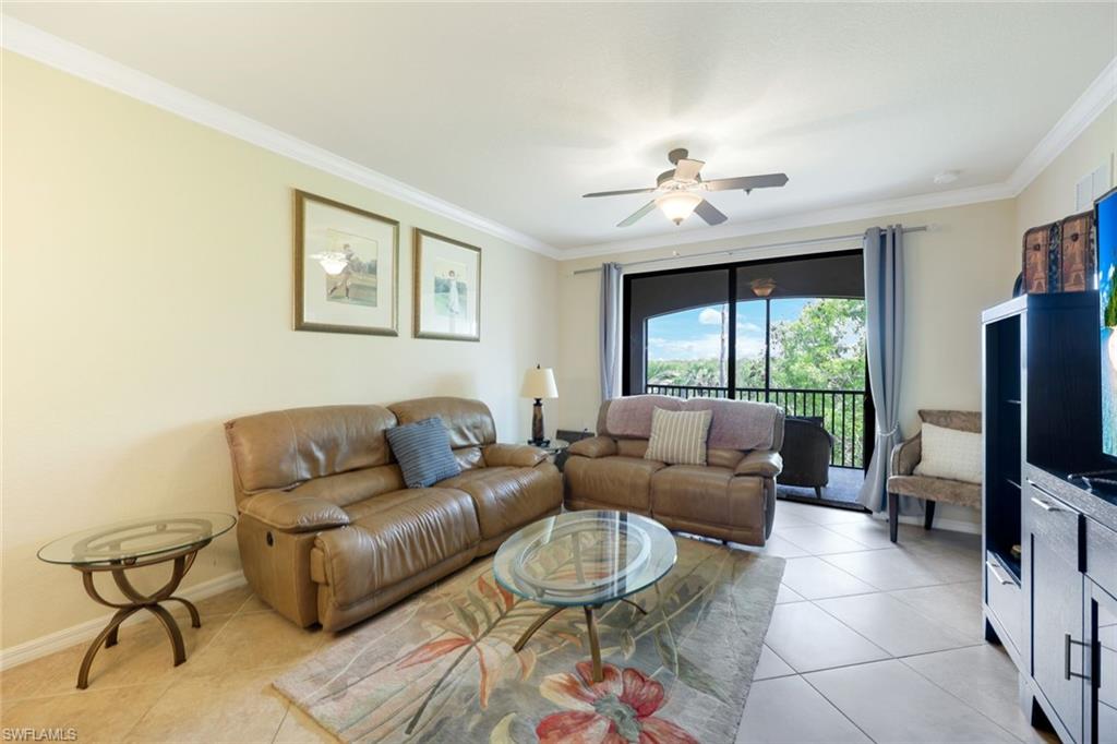 Undisclosed Address Naples, FL 34113 - Photo 5 of 24 a living room with furniture a chandelier and a window