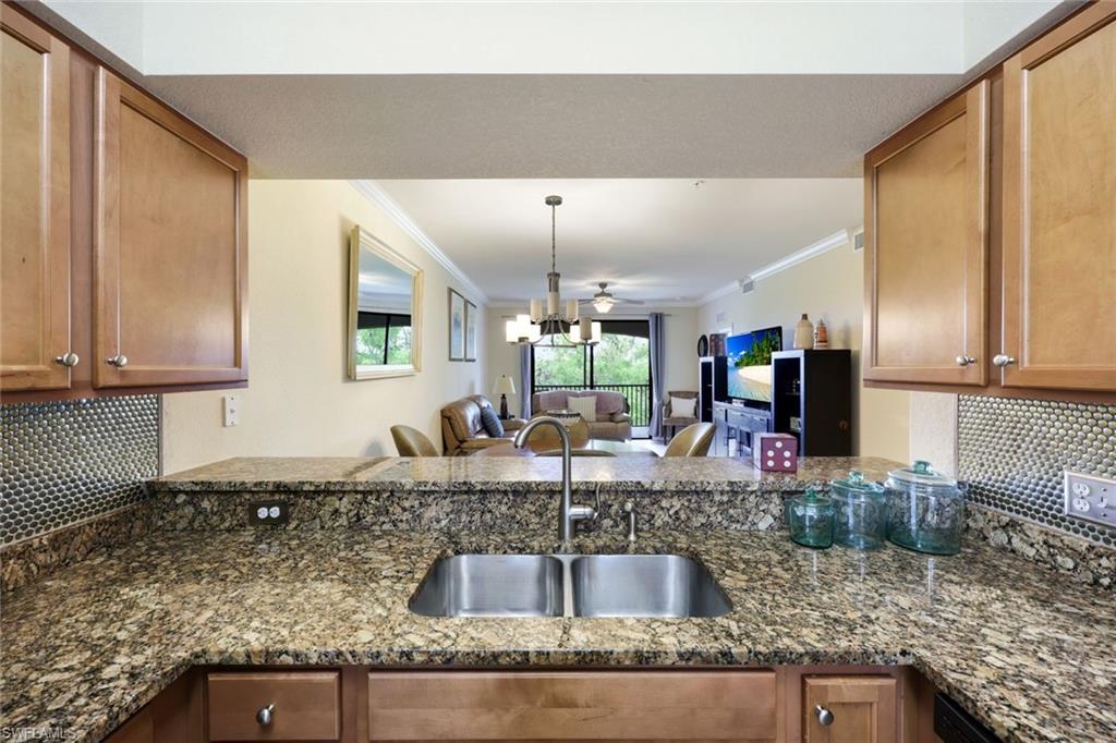 Undisclosed Address Naples, FL 34113 - Photo 24 of 24 a kitchen with granite countertop a sink and a counter top space