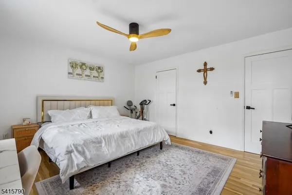 a bedroom with a bed and a desk