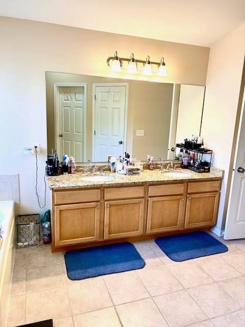 57 Sundance Road Matteson, IL 60443 - Photo 20 of 33 a kitchen with stainless steel appliances granite countertop a sink a stove and cabinets