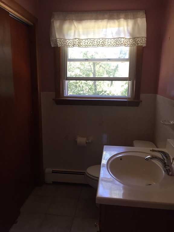 70 Bellflower Road Billerica, MA 01821 - Photo 13 of 23 a bathroom with a sink and a window
