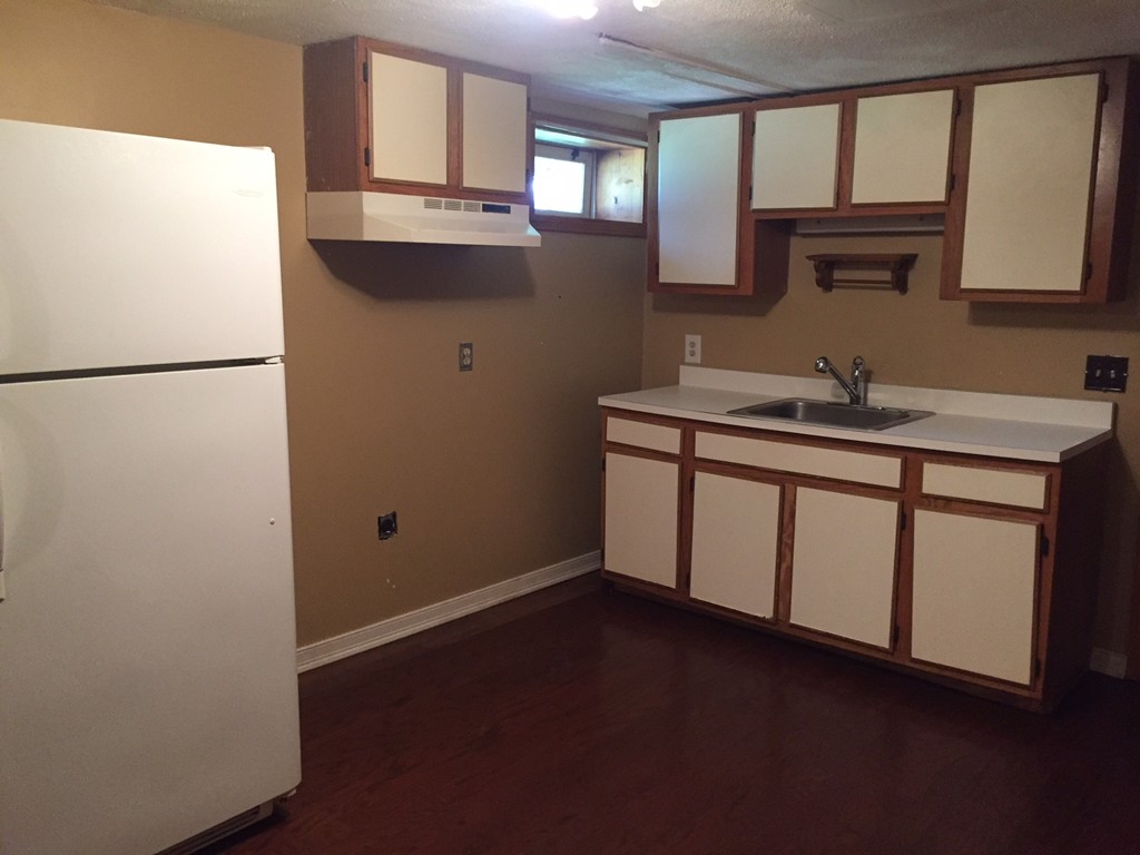 70 Bellflower Road Billerica, MA 01821 - Photo 15 of 23 a kitchen with a refrigerator and a sink