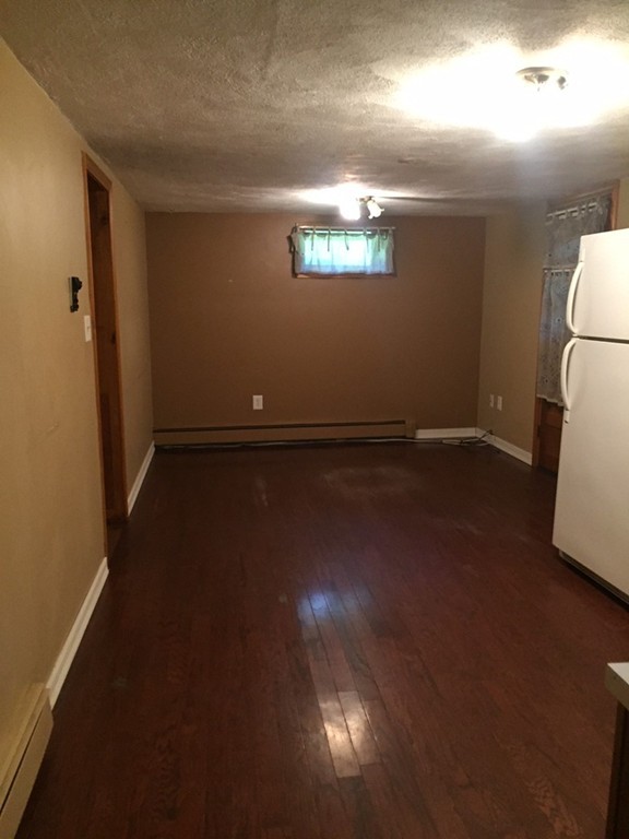 70 Bellflower Road Billerica, MA 01821 - Photo 17 of 23 a view of a room with wooden floor and a window