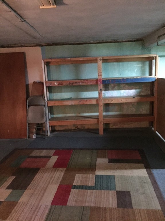 70 Bellflower Road Billerica, MA 01821 - Photo 23 of 23 a room with wooden floor and furniture
