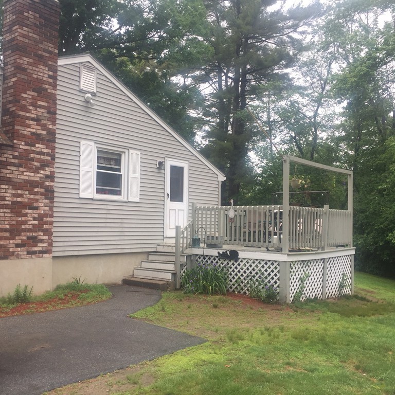 70 Bellflower Road Billerica, MA 01821 - Photo 3 of 23 a view of a house with a small yard and a large tree front of house