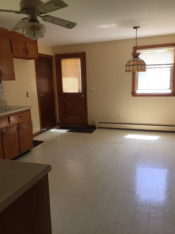 70 Bellflower Road Billerica, MA 01821 - Photo 6 of 23 a living room with hard wood floors and a ceiling fan
