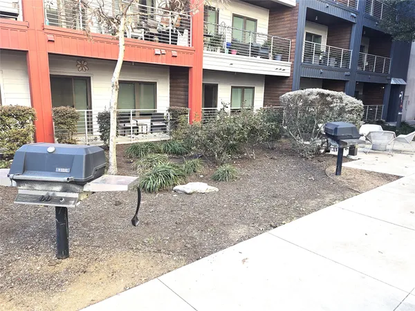 a front view of a building with outdoor seating