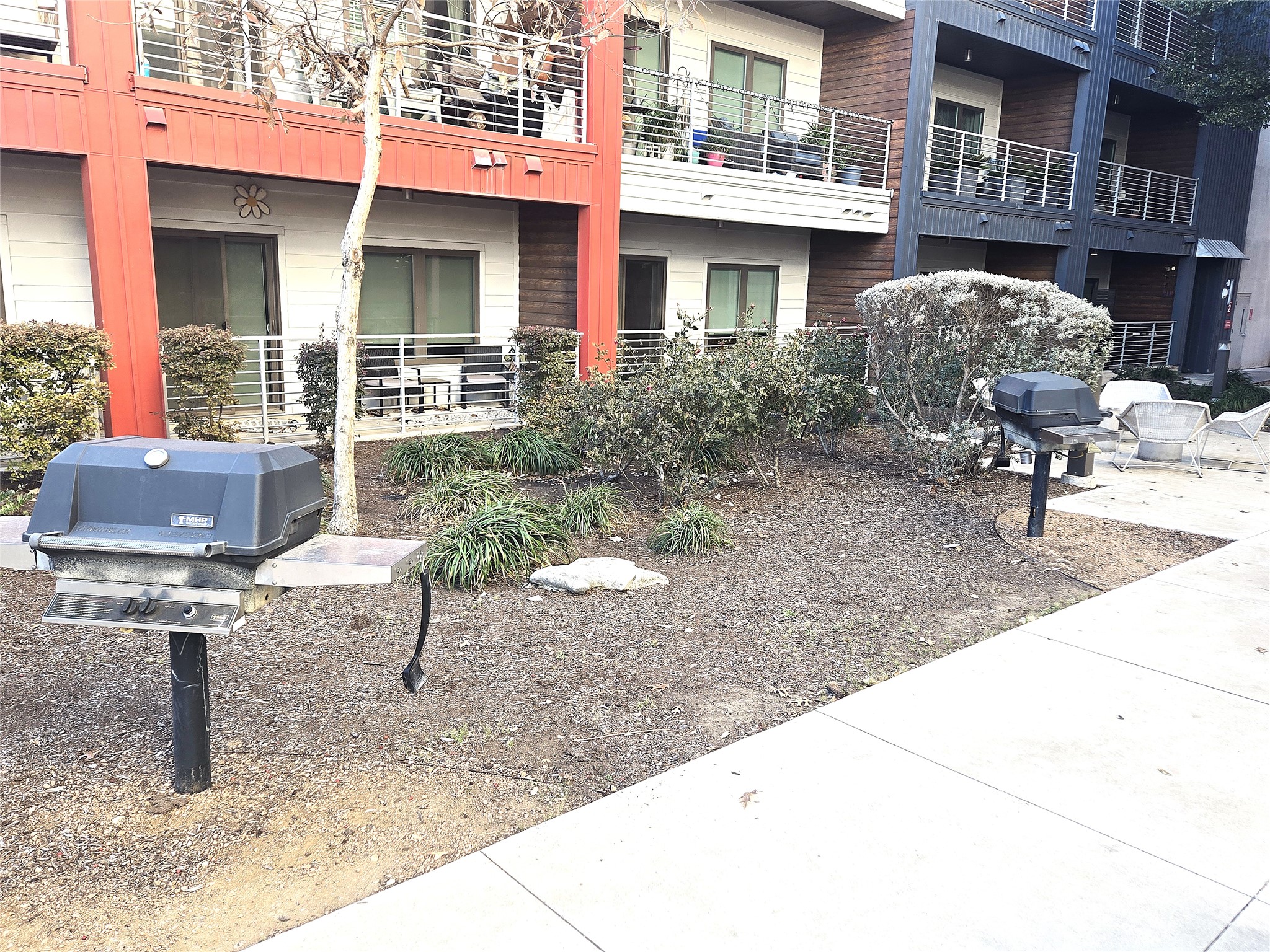 4361 South Congress Avenue, Unit 301 Austin, TX 78745 - Photo 32 of 40 a front view of a building with outdoor seating
