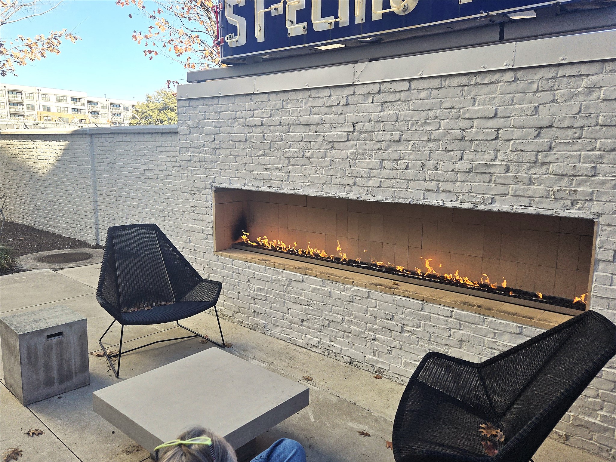4361 South Congress Avenue, Unit 301 Austin, TX 78745 - Photo 33 of 40 a living room with a chair and a fireplace