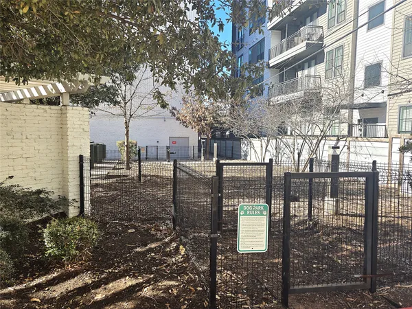 a view of a brick house with a yard